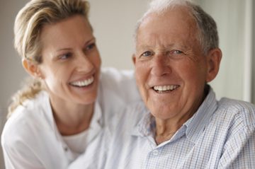 smiling man with caregiver